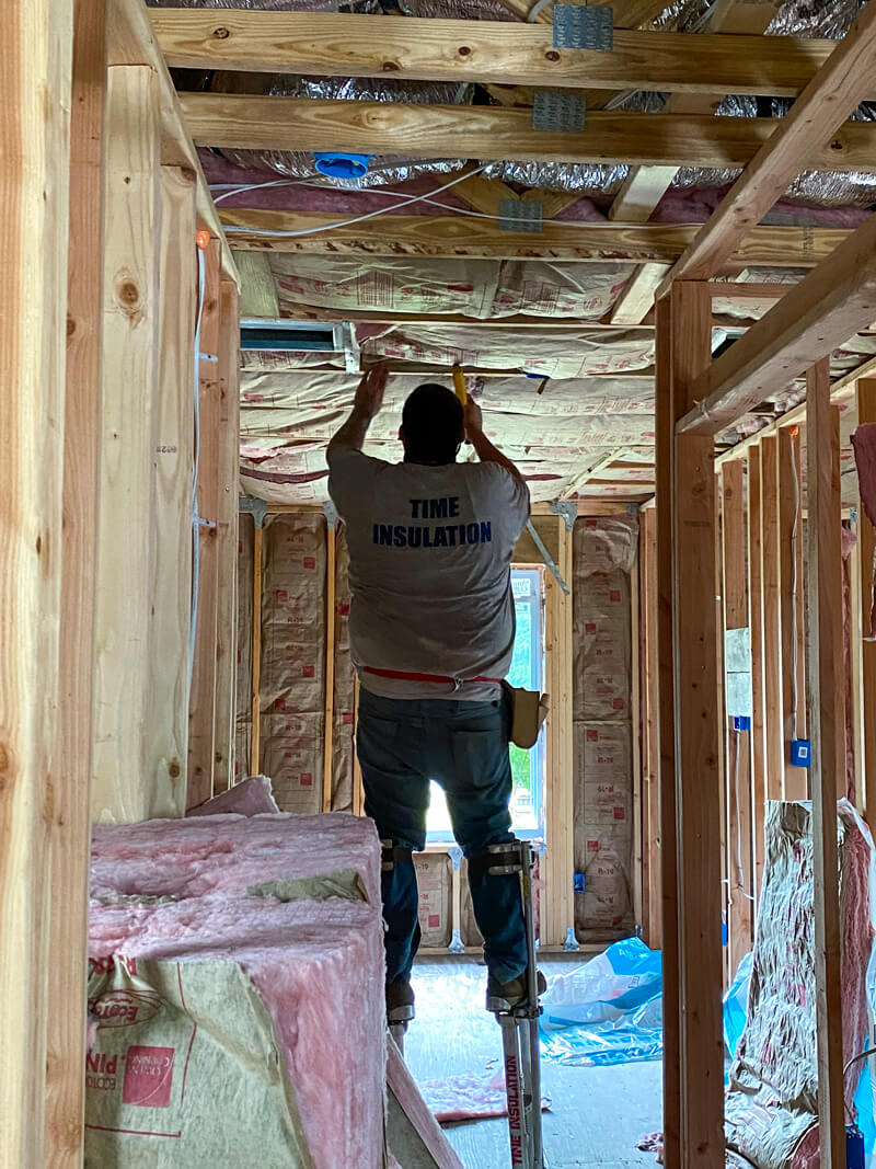 Man fixing ceiling